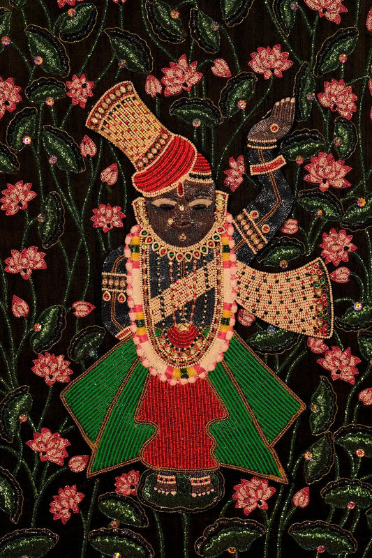 Decorative artwork of a figure with intricate beadwork on a floral background