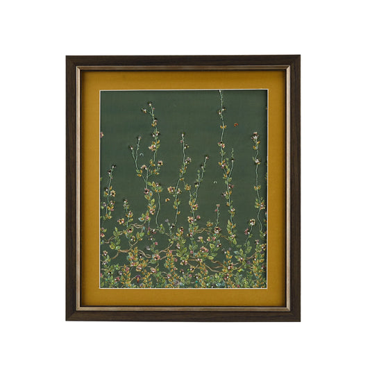 Framed artwork with floral design on a green background